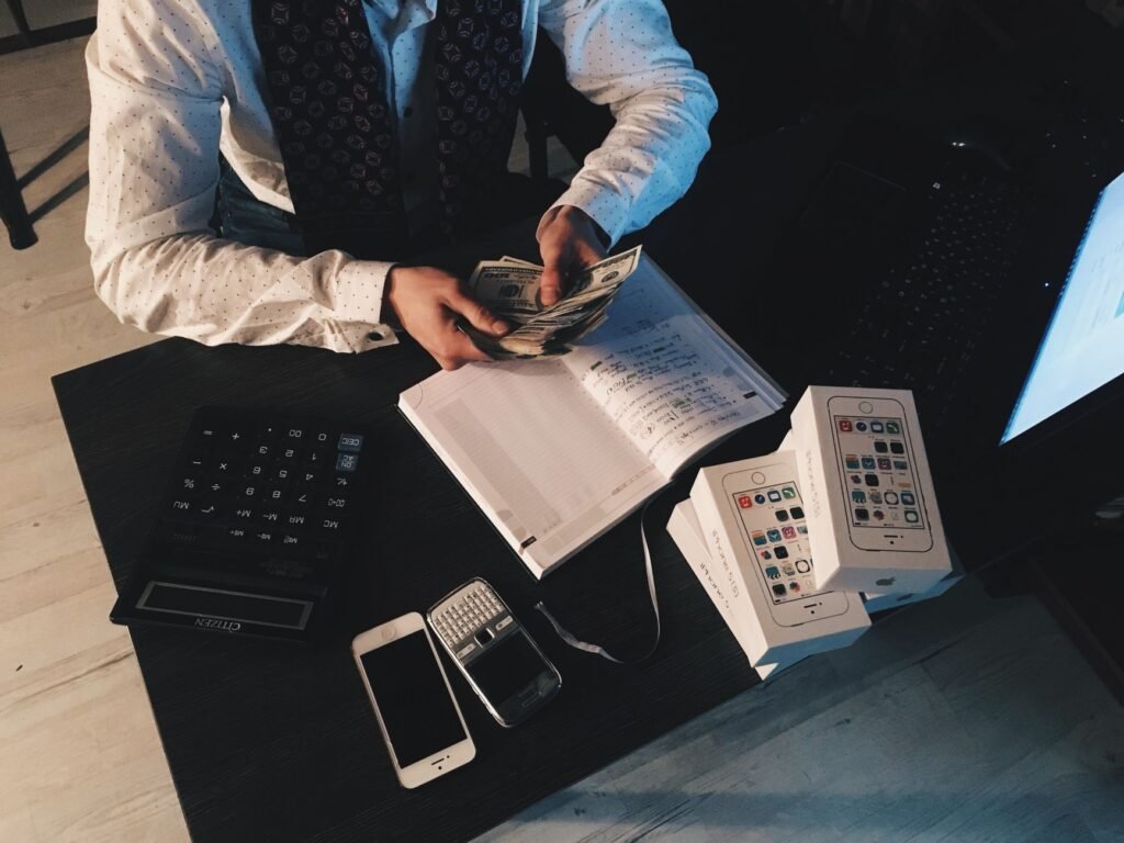 Small business accounting with a calculator and laptop
