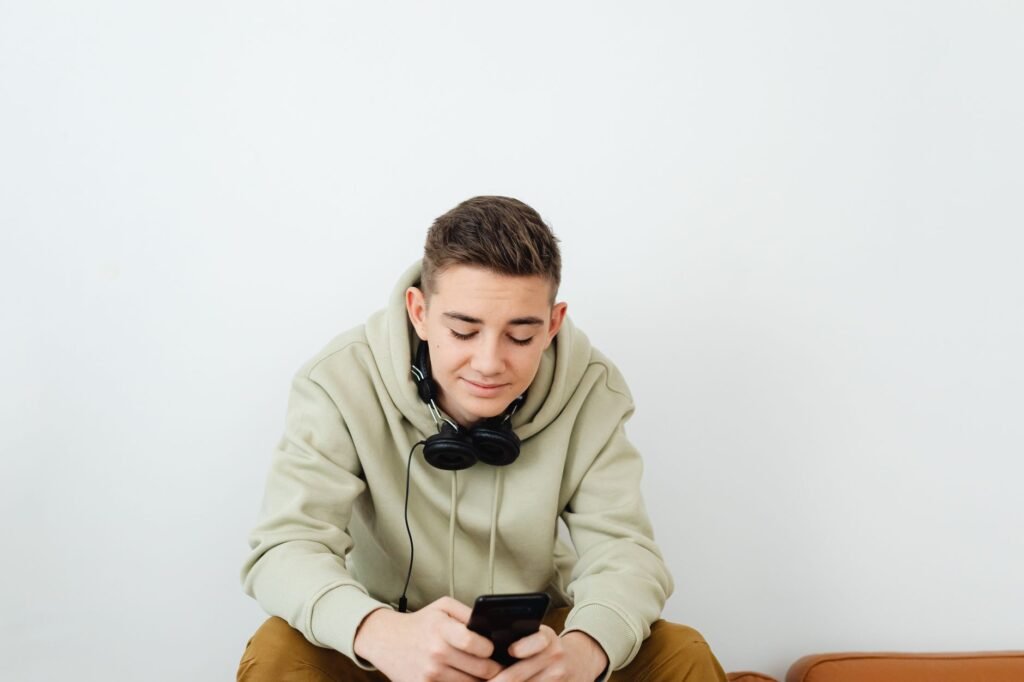 Listening to music streaming on headphones and a phone