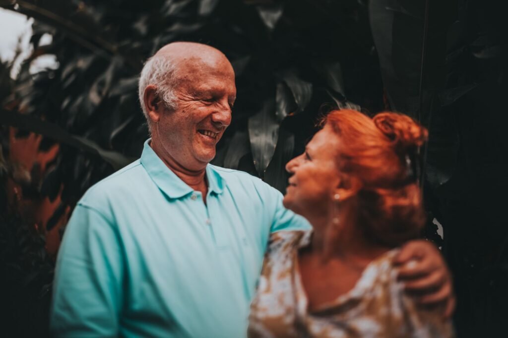Happy retired senior couple smiling together outdoors