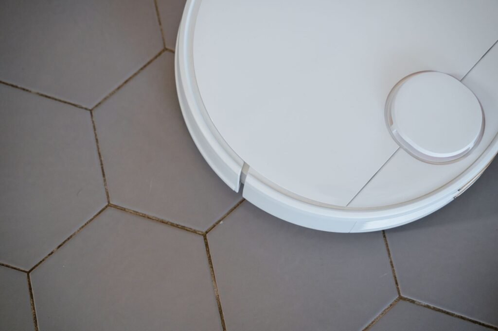 Robot vacuum cleaning a living room floor
