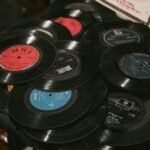 Collection of vinyl records beside a turntable