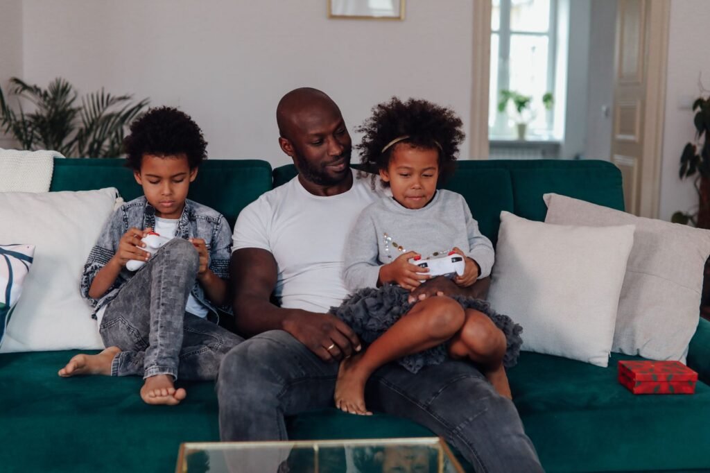 Family playing a motion-controlled video game together in a living room