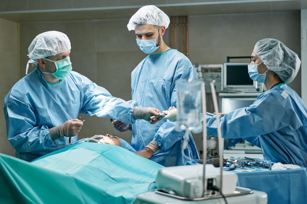 Surgical team performing an operation in a hospital operating room