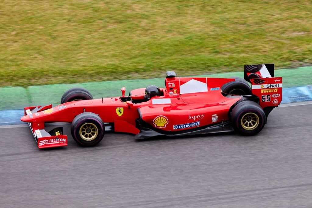Formula racing car speeding along a motorsport circuit