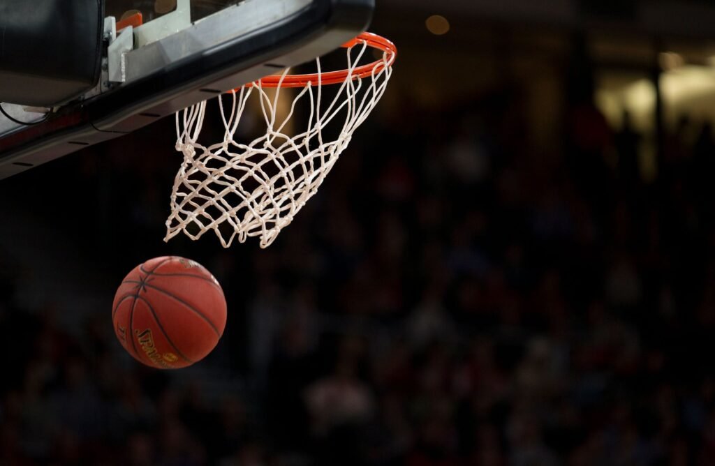 Basketball hoop and court inside an indoor arena