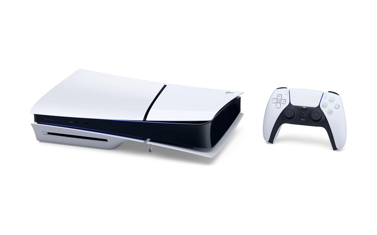 PlayStation 5 Slim disc edition console lying flat beside a white DualSense controller