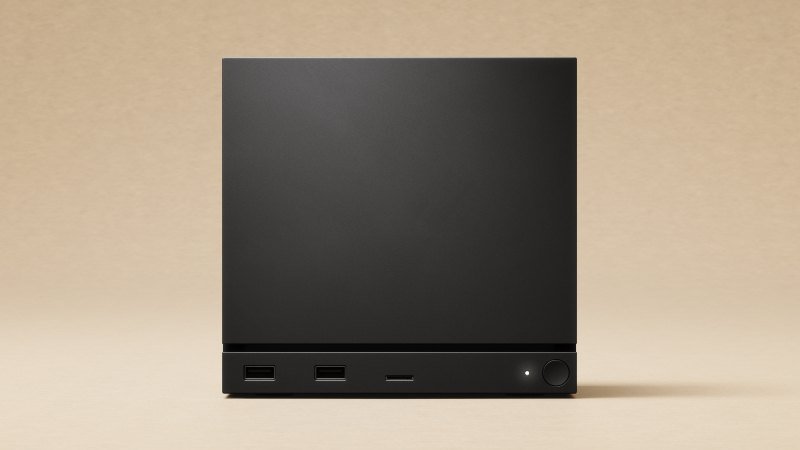Valve Steam Machine, a compact black cube with USB ports on the front