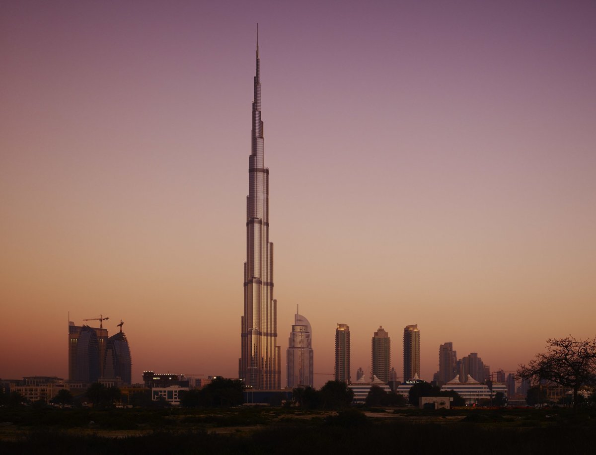 Burj Khalifa rising above the Dubai skyline at dusk