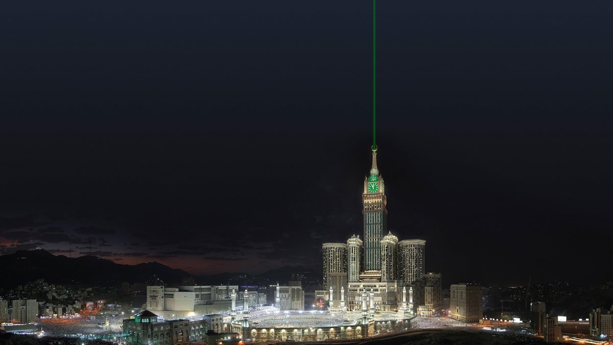 Mecca Royal Clock Tower lit up at night above the Abraj Al-Bait complex
