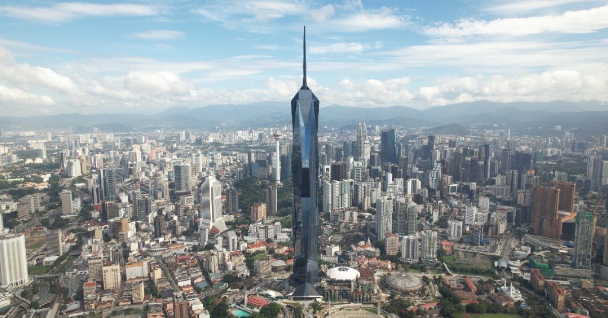 Aerial view of Merdeka 118 rising above central Kuala Lumpur