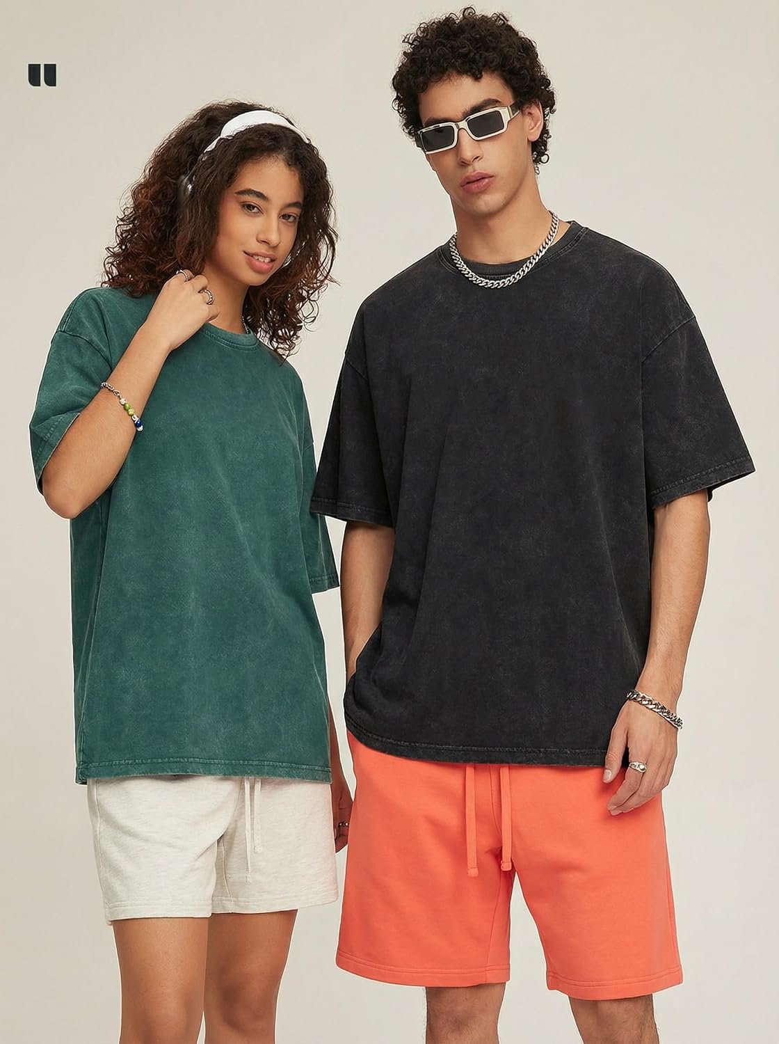 Two people wearing Aiyino vintage washed oversized cotton tees in green and charcoal