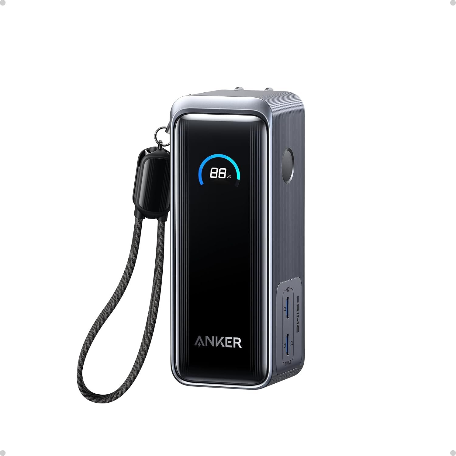 Anker Prime 9,600mAh 65W power bank with a built-in AC plug and a round status display