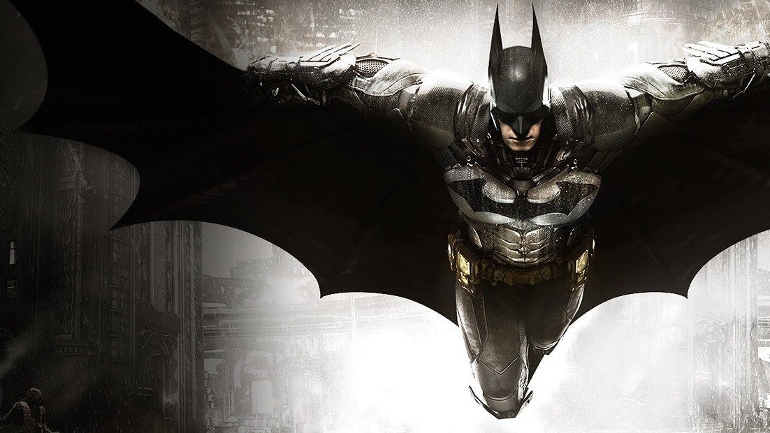 Batman diving with his cape spread wide over a misty Gotham street