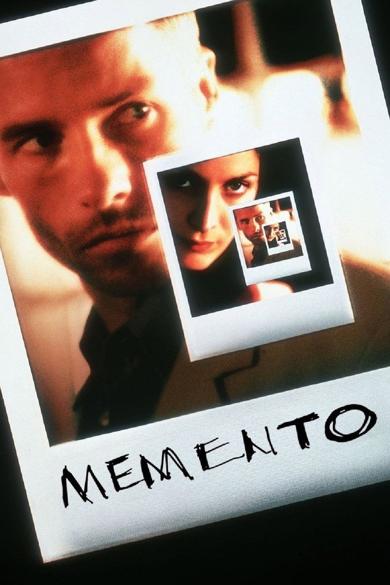 Memento poster showing a man covered in tattooed notes holding a photograph