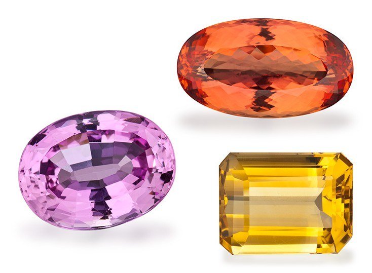 Pink and orange faceted topaz with a yellow emerald-cut citrine