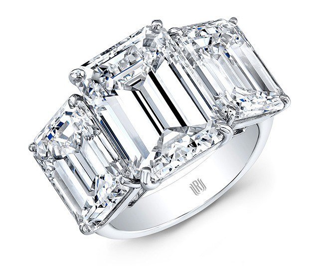 Platinum three-stone ring set with emerald-cut colorless diamonds