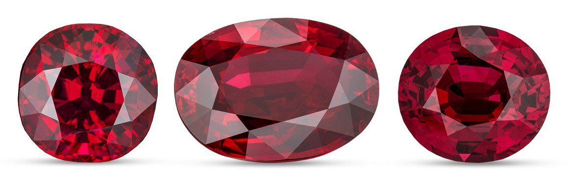 Three faceted red rubies in cushion, oval and round cuts
