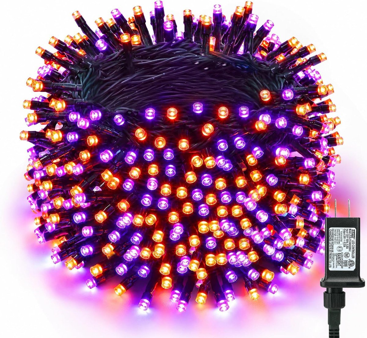 Brizled purple and orange Halloween LED string lights coiled with their plug-in controller