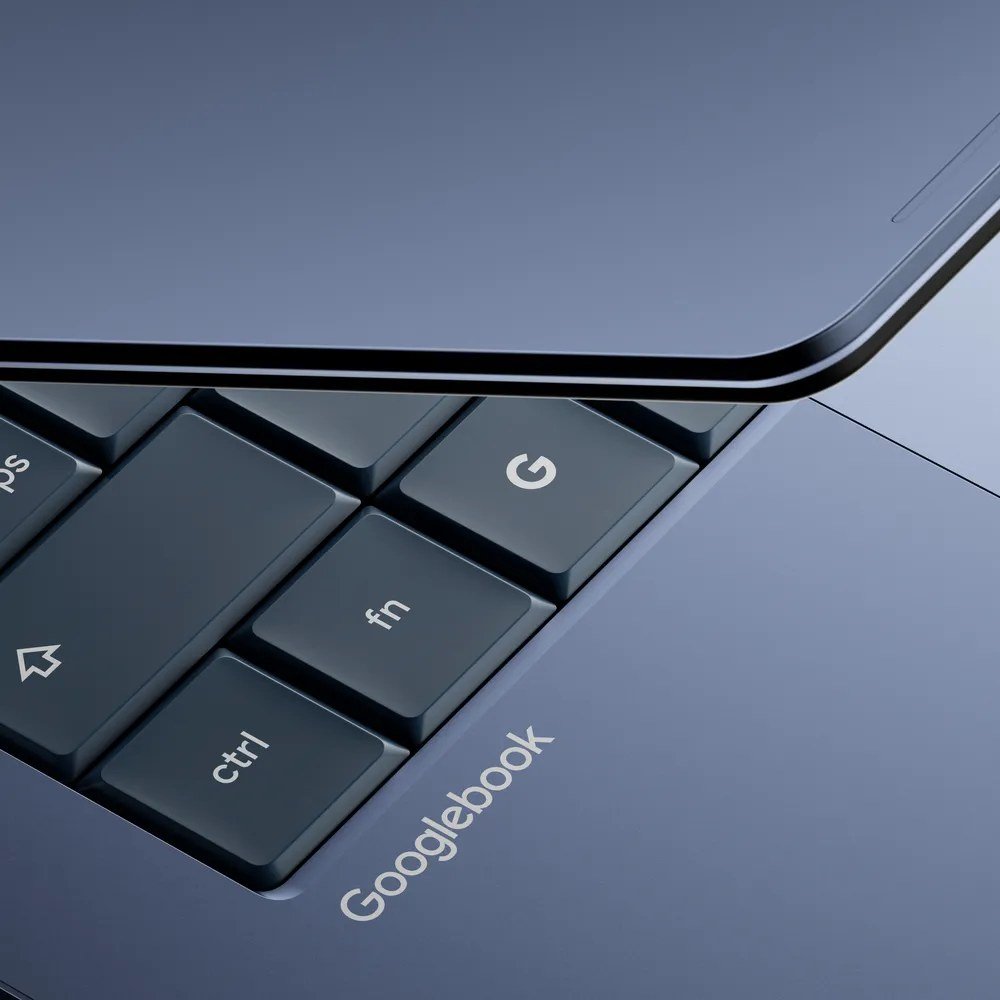 Close-up of a Googlebook keyboard corner with the Googlebook name on the palm rest