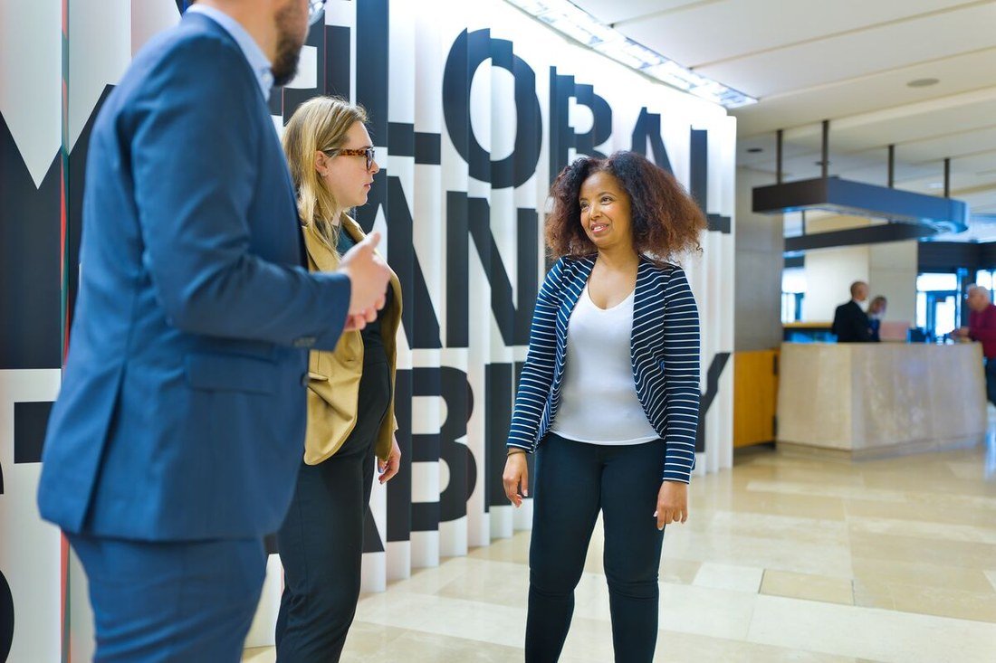Visitors in the entrance hall of the Bank for International Settlements in Basel