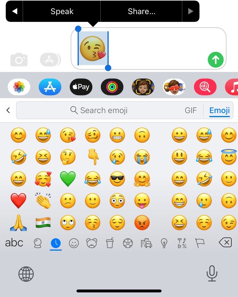 iPhone Messages with an emoji selected and the Speak button above it