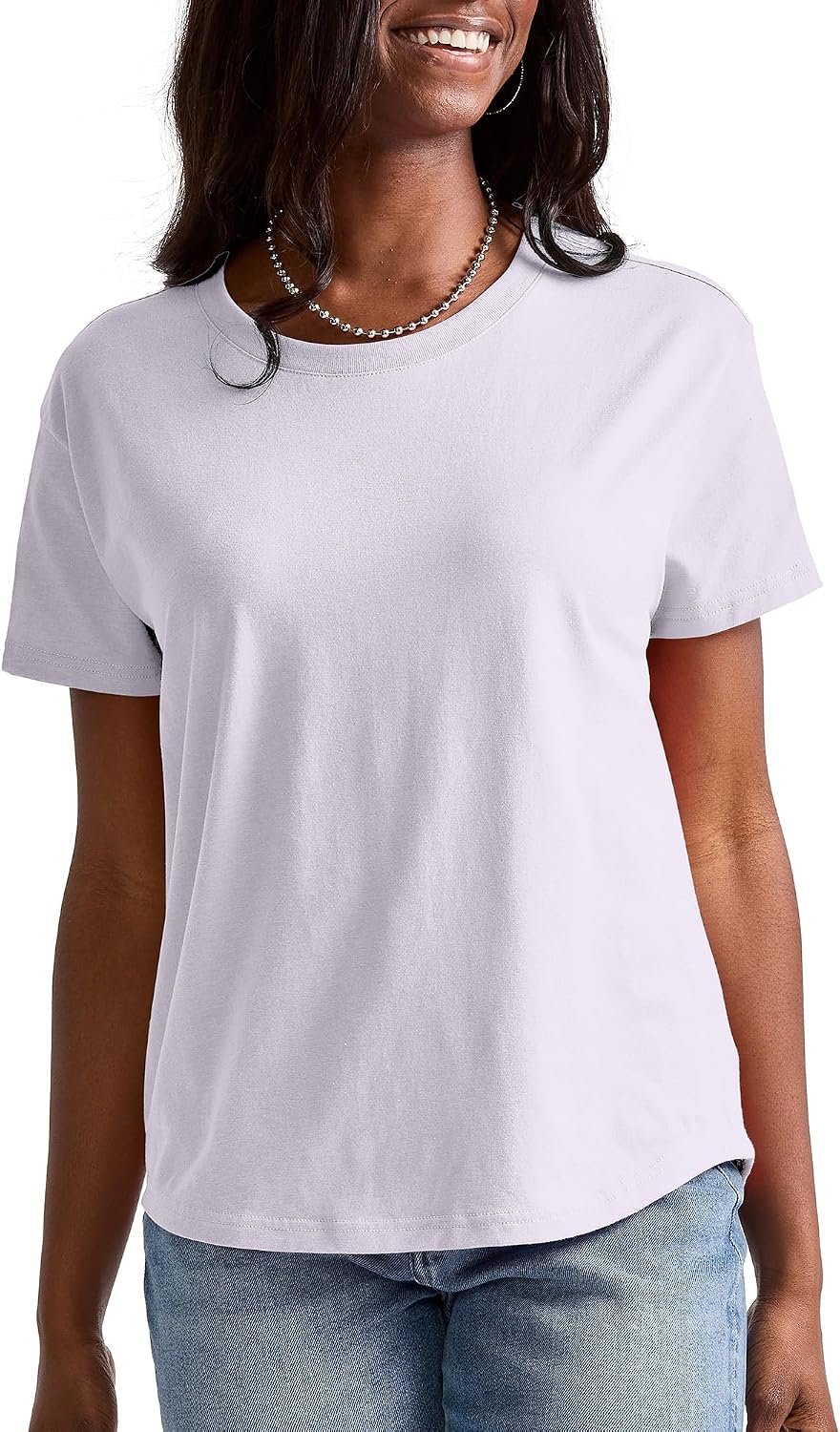 Woman wearing a lilac Hanes Originals oversized t-shirt with a curved hem