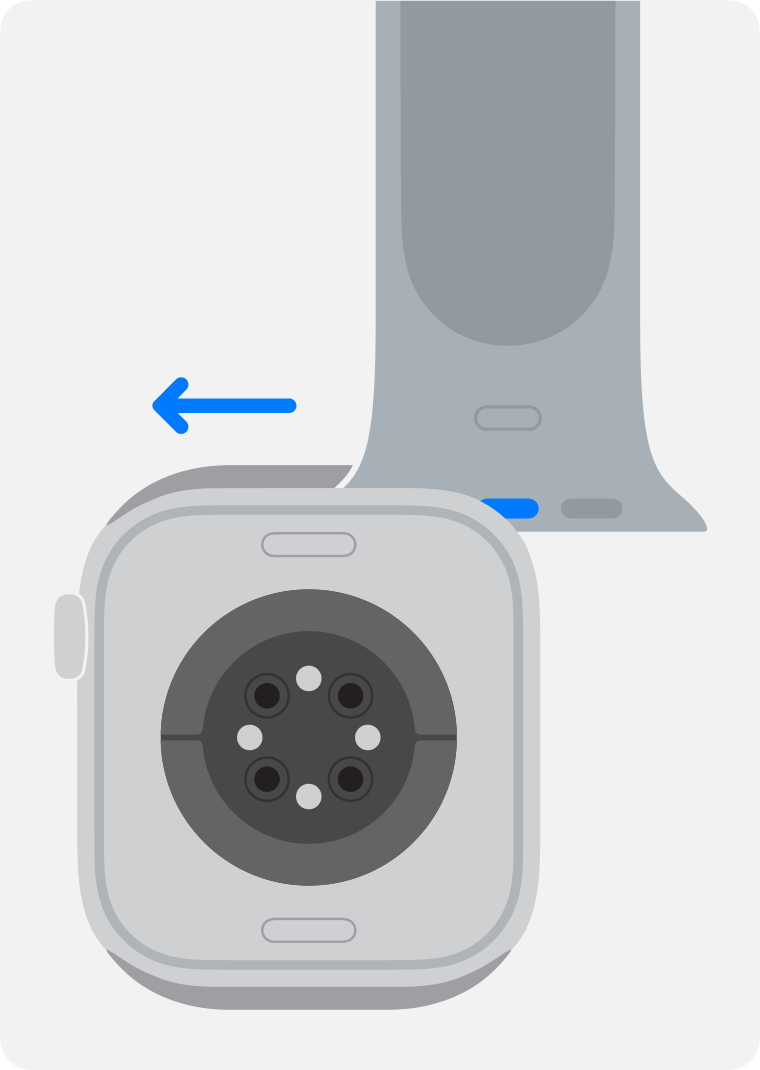 Apple Watch face down with the band release button held and the band sliding out of its slot