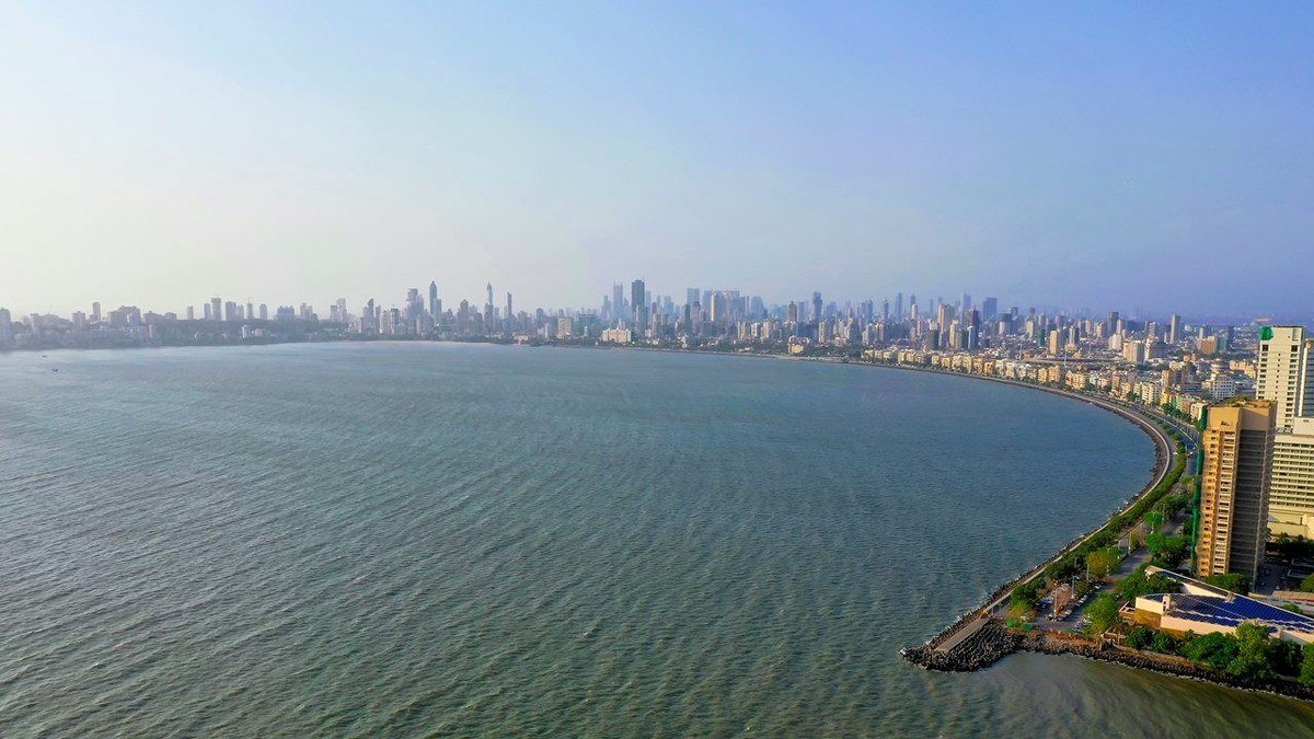 The South Mumbai coastline and city skyline seen across the water along Marine Drive