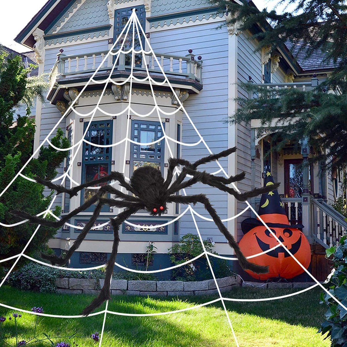 OCATO 200-inch white triangular spider web with a black 59-inch spider on a house front