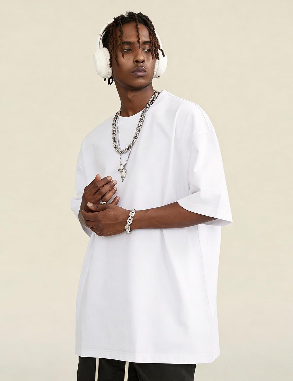 Man wearing a white Ogfao oversized heavyweight cotton t-shirt with dropped shoulders