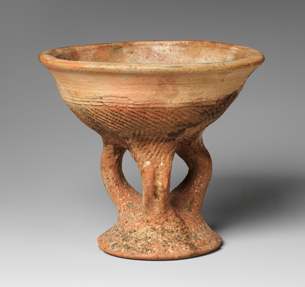 Terracotta vessel on a hollow footed base from 14th century Mali