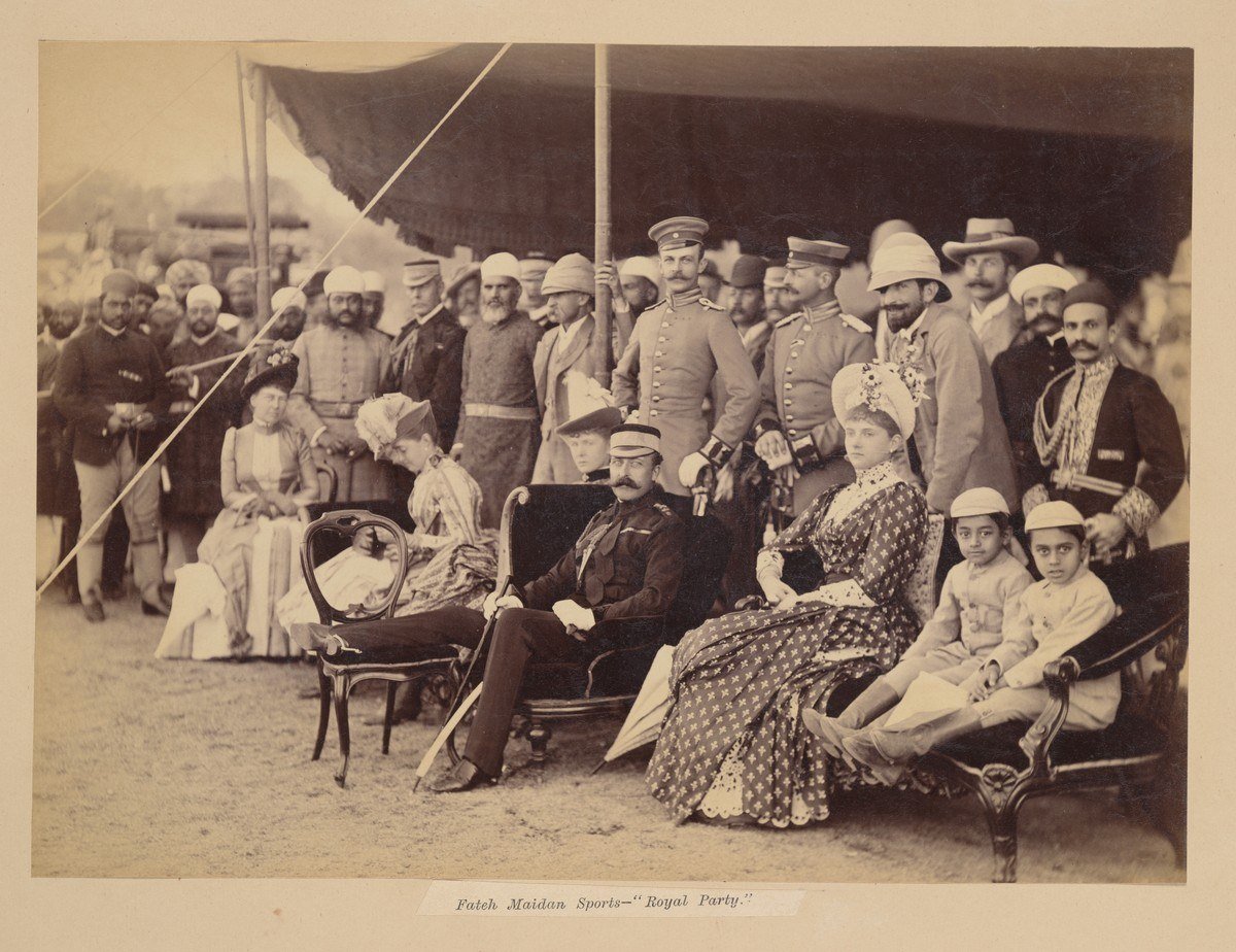 Albumen print titled The Royal Visit to Hyderabad (Deccan), January 1889, showing a seated group under a canopy