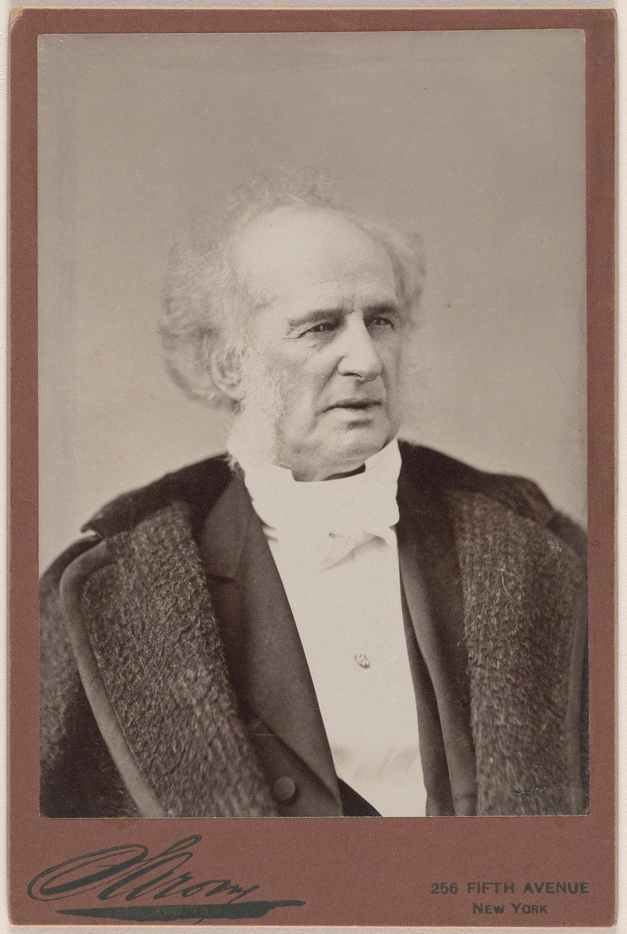 Cabinet card photograph of Cornelius Vanderbilt in a fur-collared coat