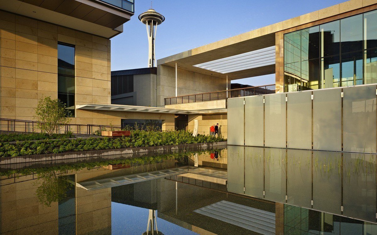 Gates Foundation campus in Seattle with the Space Needle behind a reflecting pool
