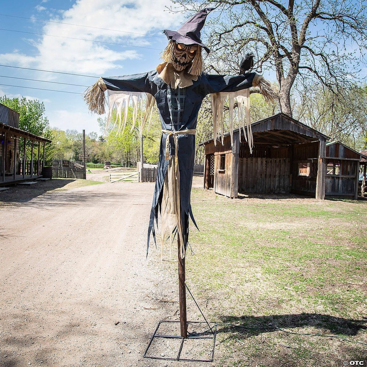 Seasonal Visions 8-foot staked scarecrow animated prop standing outdoors